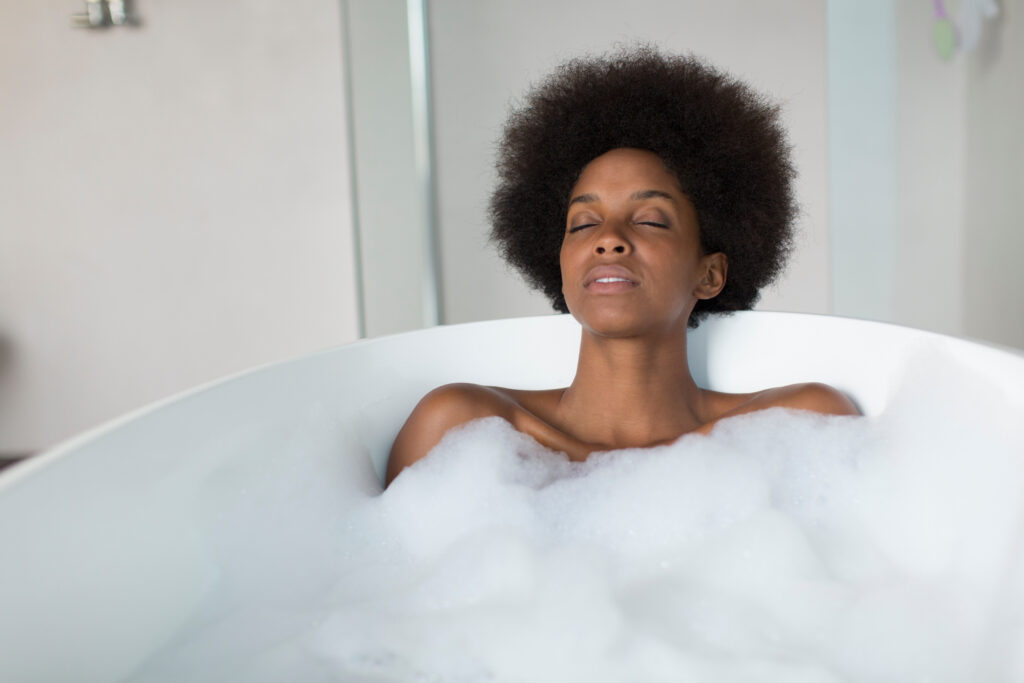 Lady relaxing in a foam bath